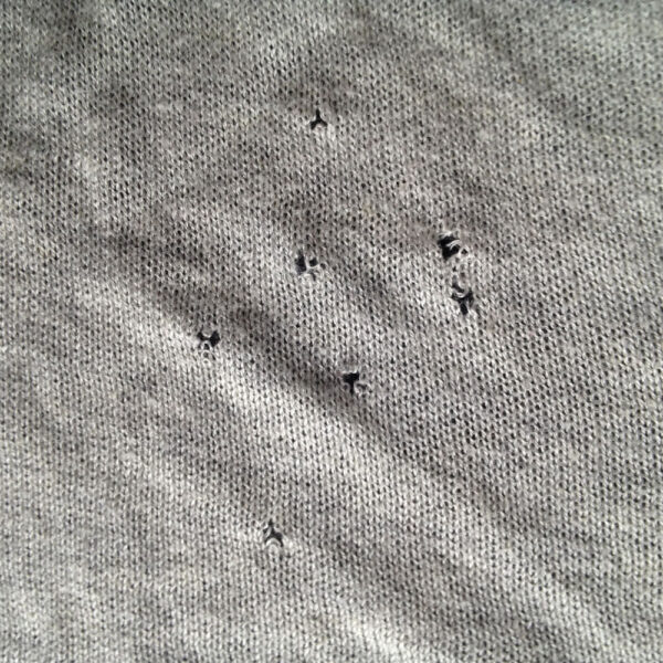 Small holes in clothes - The 12 most common causes